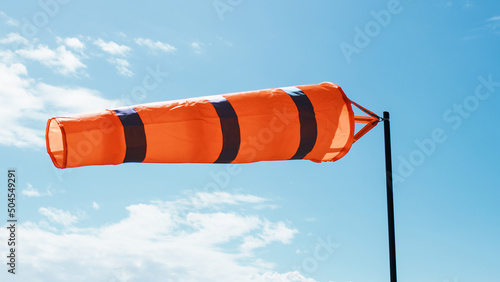 windsock with blue sky on background photo