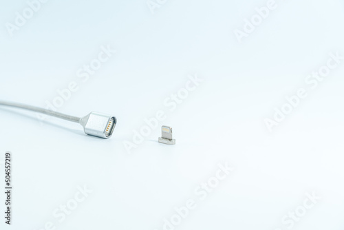 Magnetic charging cable (cord) isolated on white background