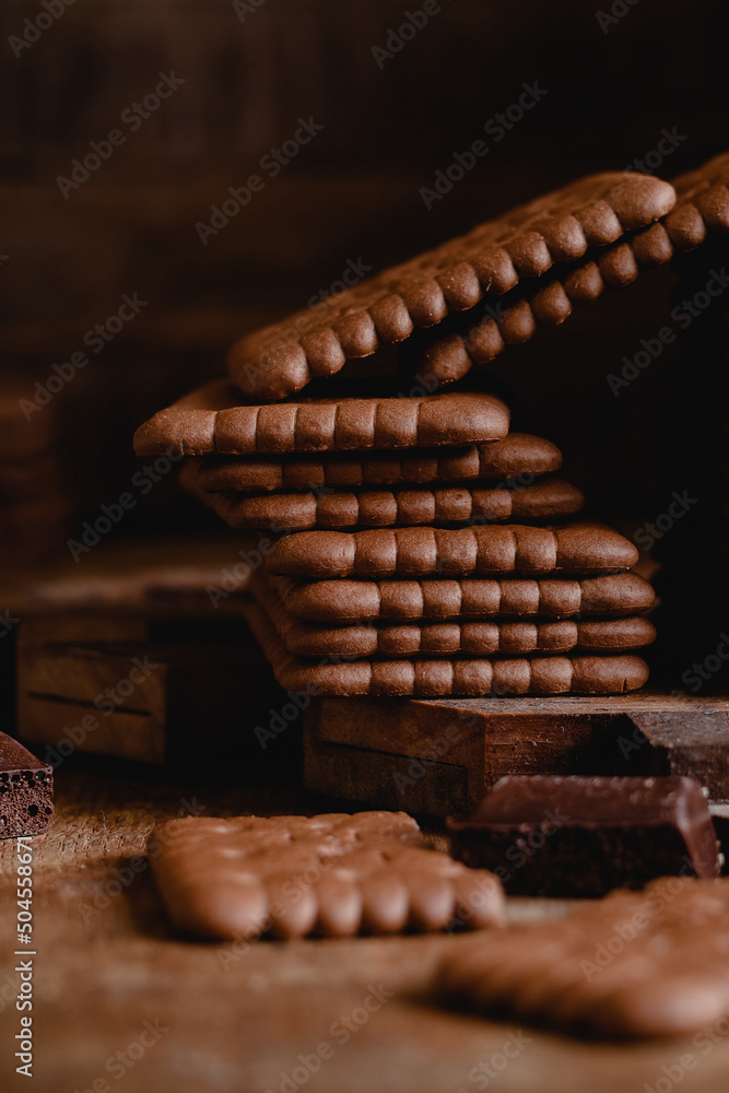 Brown chocolade crackers close up on a wooden background. Brown chocolade crackers close up on a wooden background.