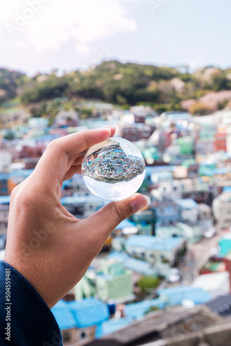 colorful busan village captured in a crystal ball