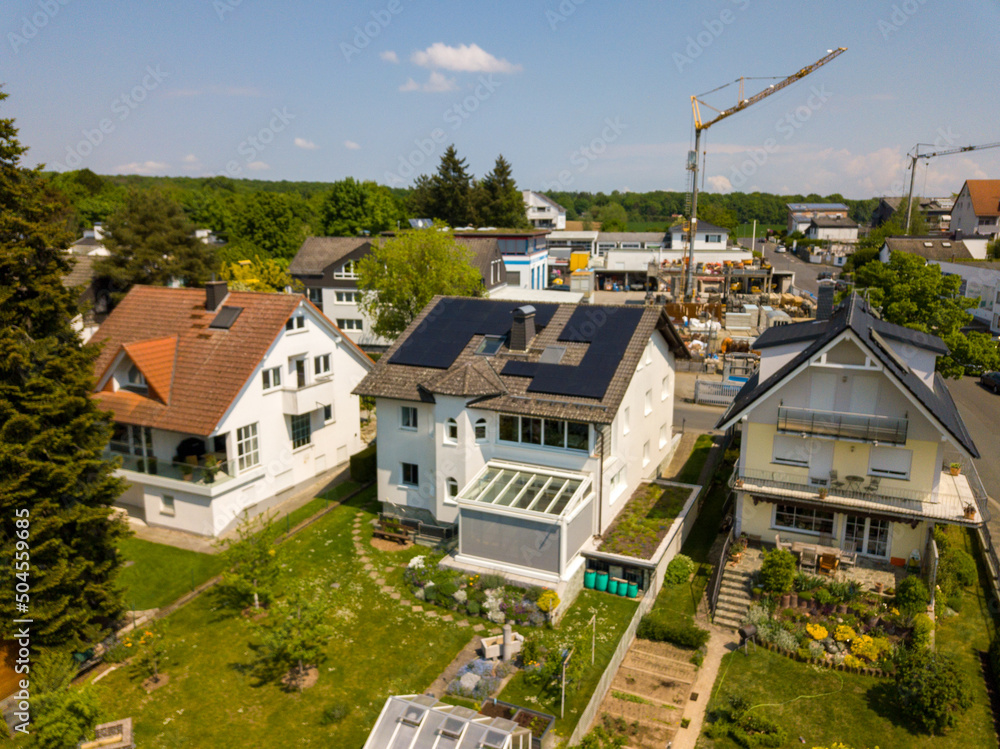 Aerial drone view of solar/photovoltaic panels on a houses roof top, Frankfurt Germany Spring Aerial drone view of solar/photovoltaic panels on a houses roof top, Frankfurt Germany Spring