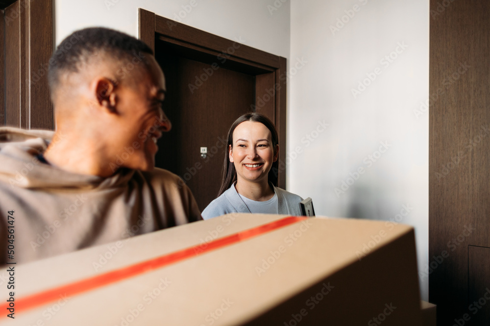 Man and Woman Moving into New Building Man and Woman Moving into New Building