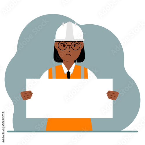 Engineer woman holding a blank sheet of paper. The concept of a builder, engineer, planner or designer.