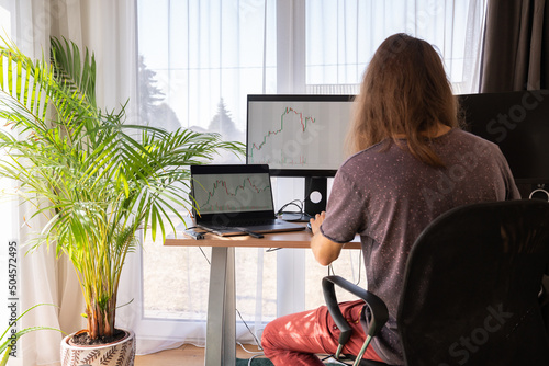 Man Analysing Stock Charts photo