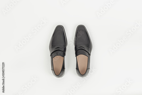 Wallpaper Mural Beautiful black leather male fashion penny loafer isolated on white background top view Torontodigital.ca