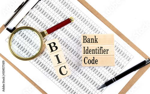 Canvas Print BIC Bank Identifier Code text on wooden block on chart background