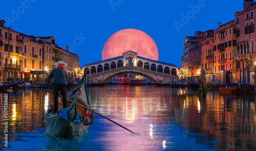 Gondola near Rialto Bridge with full moon rising - Venice, Italy "Elements of this image furnished by NASA"