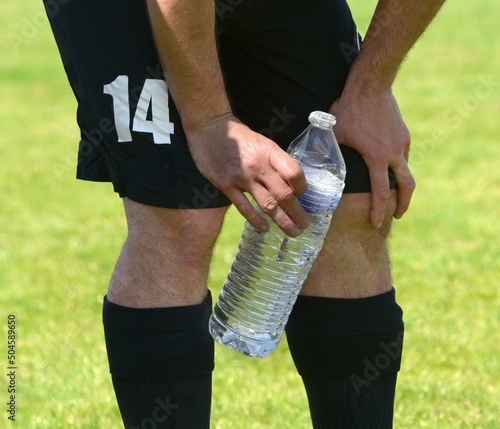 Konstfotografi le joueur de football se désaltère