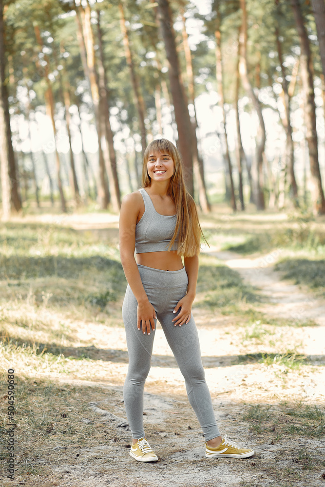 Cute girl doing yoga in a summer forest Cute girl doing yoga in a summer forest