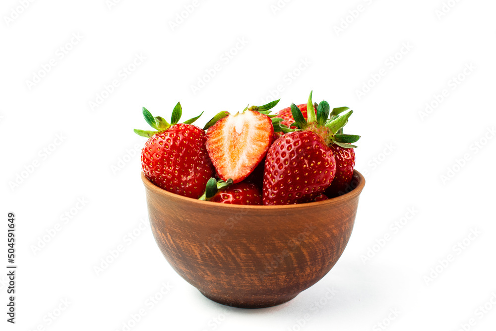 Fresh strawberries in a brown bowl on white background Fresh strawberries in a brown bowl on white background