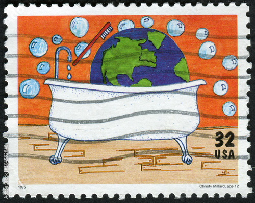 USA - CIRCA 1995: Postage stamp dedicated to 25th anniversary of Earth day, shows a child's drawing of Christy Millard photo