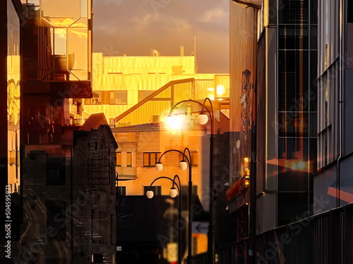Photography reflection evening orange sunset city street on building  and vitrine windows g