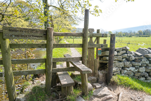 Traditional country stile with wooden dog gate photo