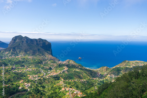 Miradouro da Portela, view of Penha de agua mountain and eagle rock and Porto Da Cruz, Madeira island photo