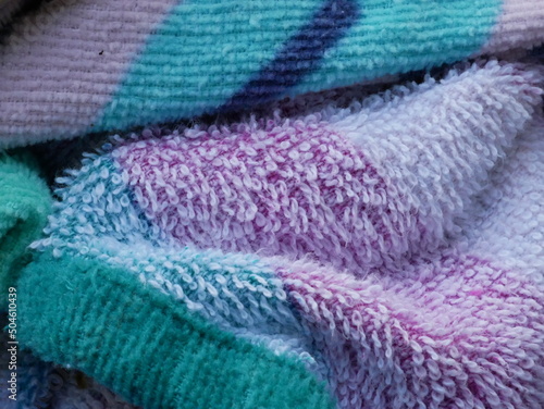 colored terry cloth towel, rolled and irregular