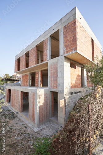Construction of a modern residential building with flat roof