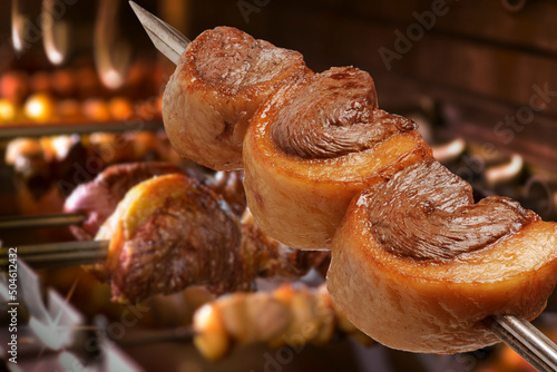 Picanha barbecue roasted over hot coals. This form of barbecue is widely consumed throughout Brazil. photo