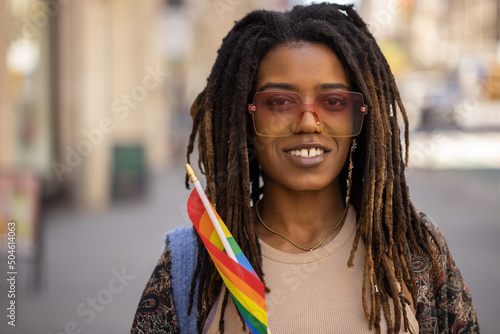 LGBTQ young black woman in city portrait smile happy