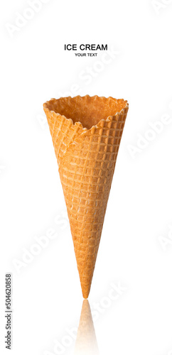 An empty waffle cone is isolated on a white background. Side view, vertical.