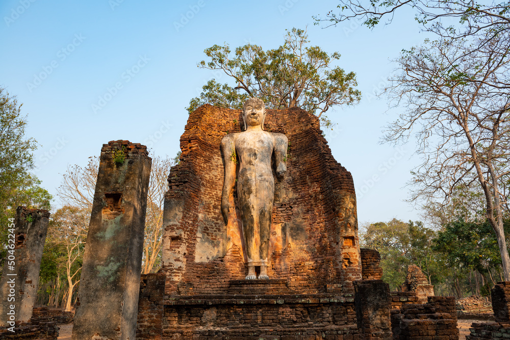 Ancient Standing Buddha Statue in historical park