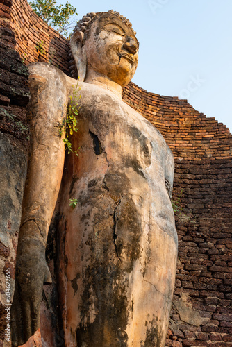 Ancient Standing Buddha Statue in historical park