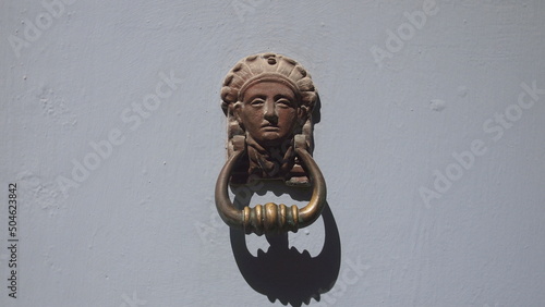 Vintage brass door knocker on an old door, Cuba, Havana
