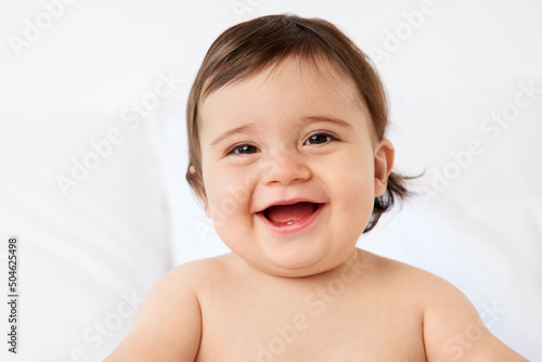 Laughing portrait of chubby baby boy