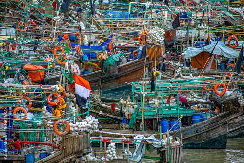 Fishing boats are arranged in river shore