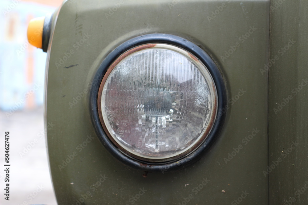 the headlight of an old truck