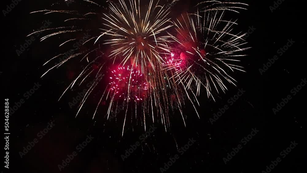 Final fireworks scene. Bright flashes of festive fireworks in the night sky. Multiple salute explosions. Fading golden lights with a black night sky at the end. HD video, time lapse Final fireworks scene. Bright flashes of festive fireworks in the night sky. Multiple salute explosions. Fading golden lights with a black night sky at the end. HD video, time lapse
