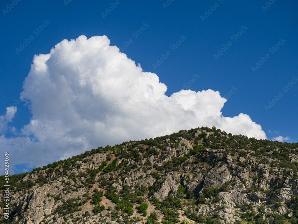 white clouds over the mountain