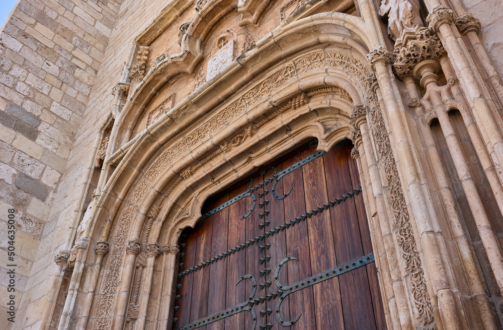 Principal gate detail on the western facade of the Magistral Cathedral of Saints Justo and Pastor. Alcala de Henares, Region of Madrid, Spain.