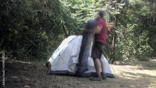 A man unmount/put down a tent in southeast Brazil  photo
