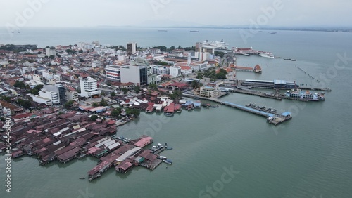 Georgetown, Penang Malaysia - May 13, 2022: The Clan Jetties of Georgetown Penang, Malaysia. Wooden villages built on stilts at the sea coast by the different clans of the Penang Chinese community. photo