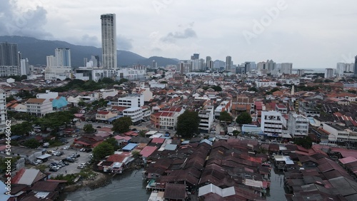 Georgetown, Penang Malaysia - May 13, 2022: The Clan Jetties of Georgetown Penang, Malaysia. Wooden villages built on stilts at the sea coast by the different clans of the Penang Chinese community. photo