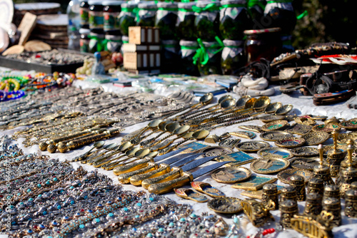Souvenir stall. Street shop with handmade spoons, bracelets and beads.