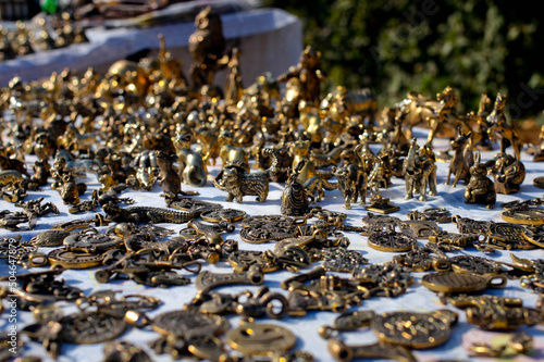 Souvenir stall. Street shop with metal figures.