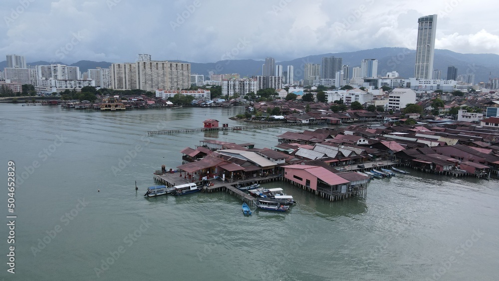 Georgetown, Penang Malaysia - May 13, 2022: The Clan Jetties of Georgetown Penang, Malaysia. Wooden villages built on stilts at the sea coast by the different clans of the Penang Chinese community.