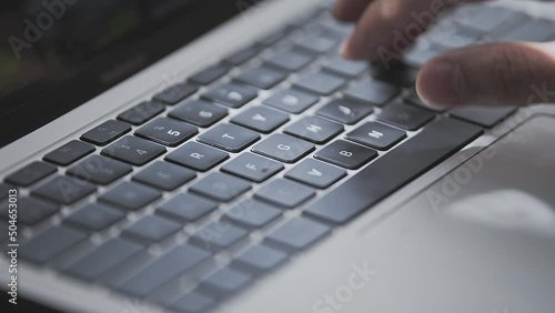 Close up of a young man hand busy typing. 