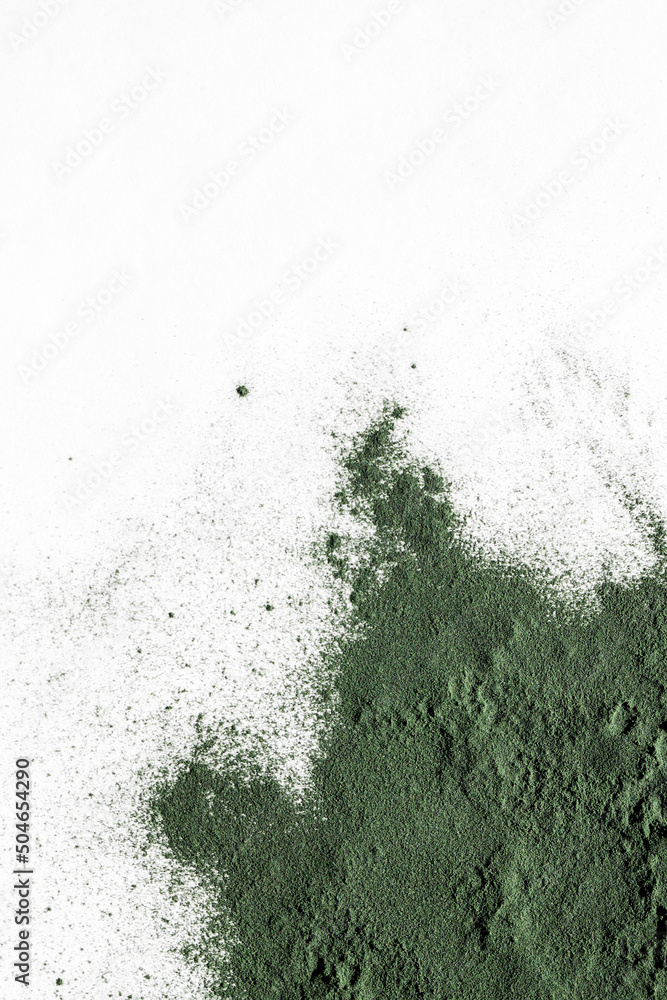 natural additives and superfood. green spirulina algae powder on white background. healthy lifestyle concept. organic food. copy space natural additives and superfood. green spirulina algae powder on white background. healthy lifestyle concept. organic food. copy space