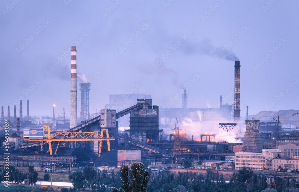 Azovstal in Mariupol, Ukraine before war. Steel plant at night. Steel factory with smokestacks. Steel works, iron works. Heavy industry. Industrial landscape with metallurgical combine, smokes, lights Azovstal in Mariupol, Ukraine before war. Steel plant at night. Steel factory with smokestacks. Steel works, iron works. Heavy industry. Industrial landscape with metallurgical combine, smokes, lights
