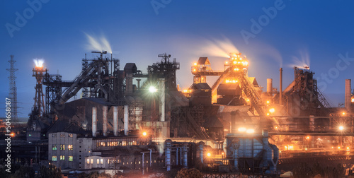 Azovstal in Mariupol, Ukraine before war. Steel plant at night. Steel factory with smokestacks. Steel works, iron works. Heavy industry. Industrial landscape with metallurgical combine, smokes, lights