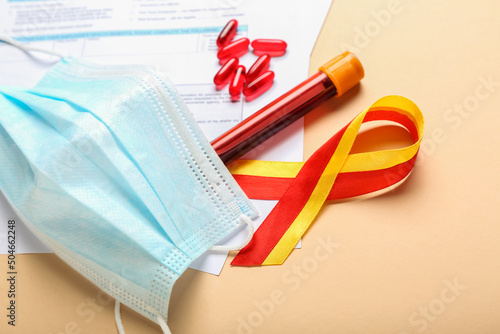 Awareness ribbon with pills...