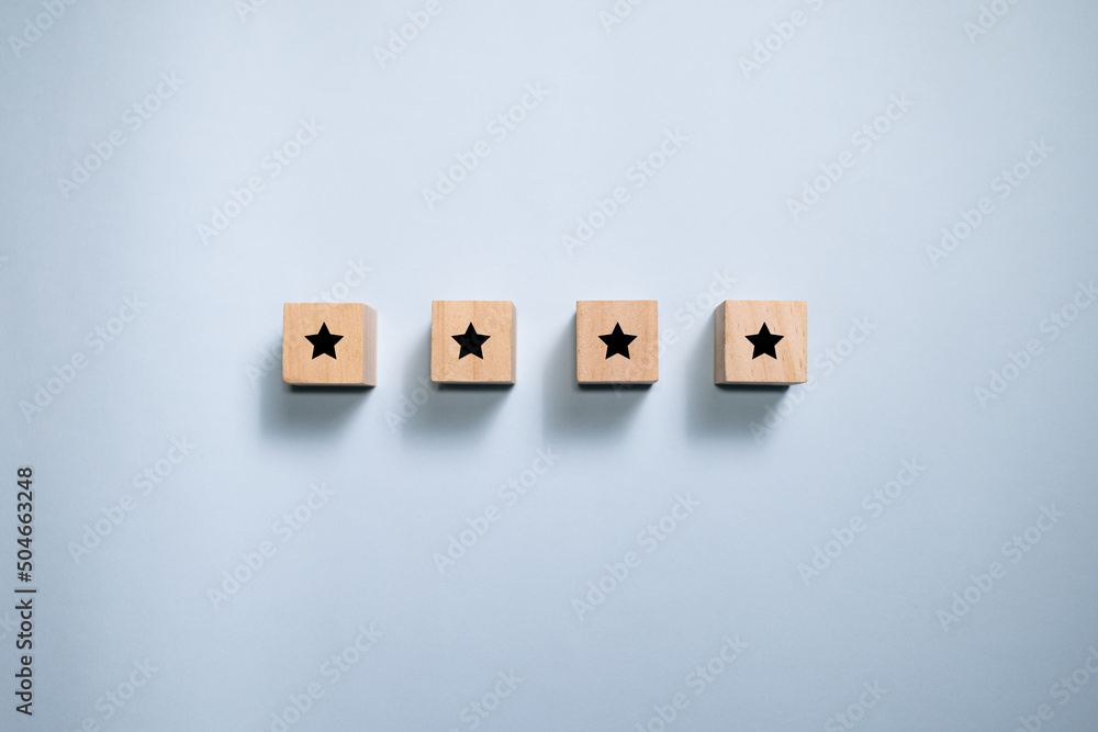 Top view wooden blocks with star rating graphic. Concept for rating and customer satisfaction. Top view wooden blocks with star rating graphic. Concept for rating and customer satisfaction.