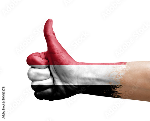 Hand making thumb up painted with flag of yemen