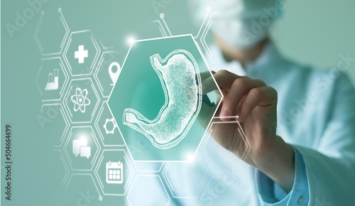Konstfotografi Unrecognizable female doctor holding graphic virtual visualization model of Stomach organ in hands