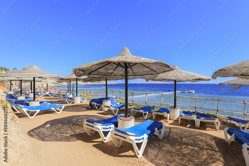 Beach with sun loungers and parasols in Sharm El Sheikh in Egypt