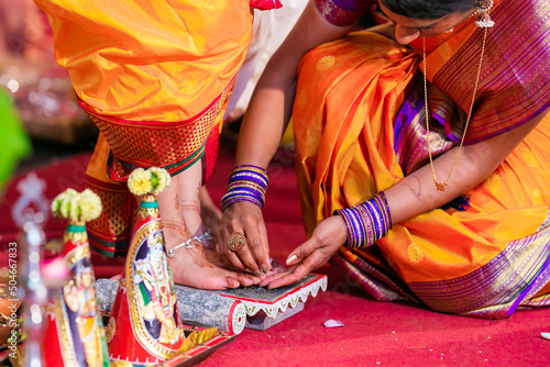 Indian Hindu wedding ceremony and rituals bride and groom's feet close up