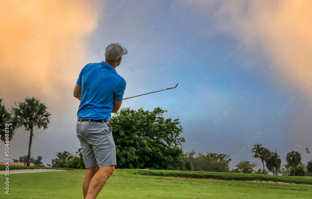 golfer chipping onto the green golfer chipping onto the green
