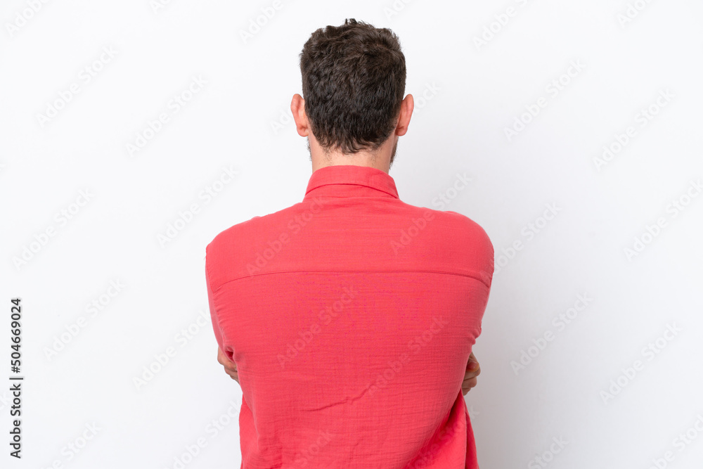 Young Brazilian man isolated on white background in back position Young Brazilian man isolated on white background in back position